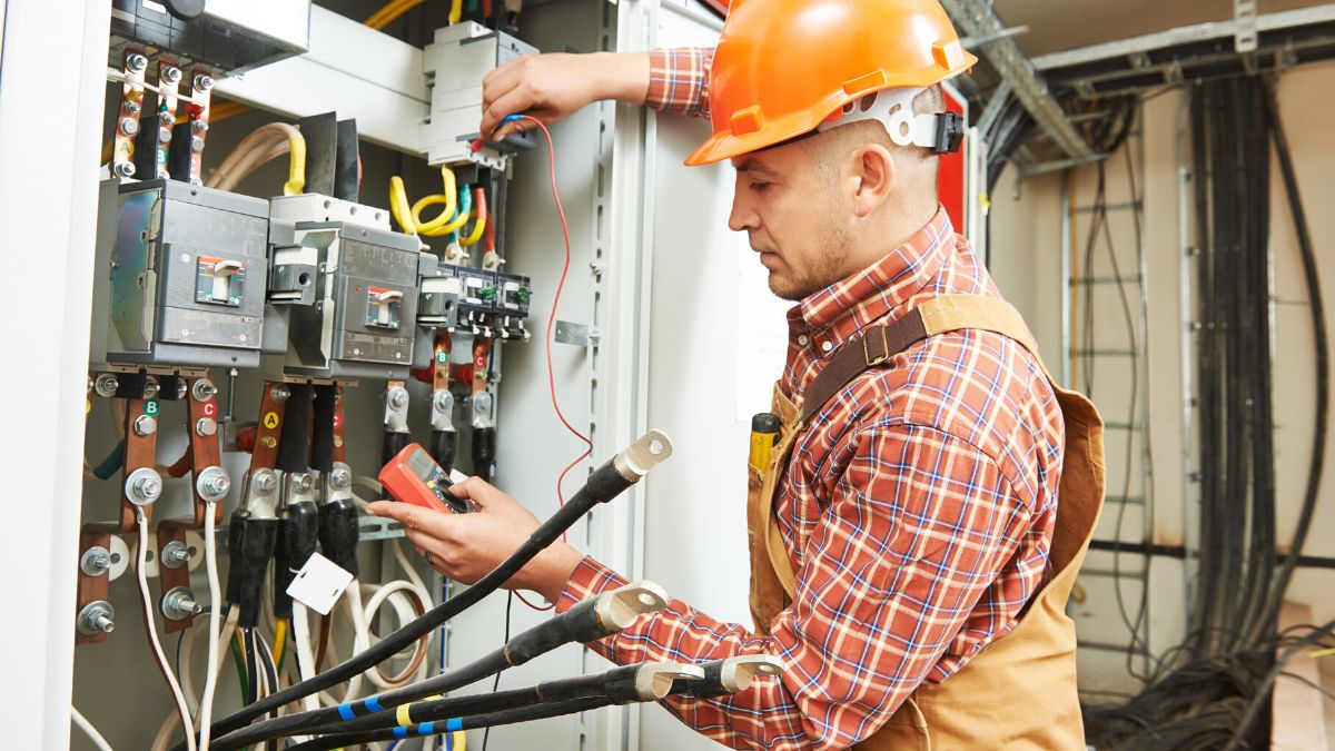 Electrician using a meter to test electricity.